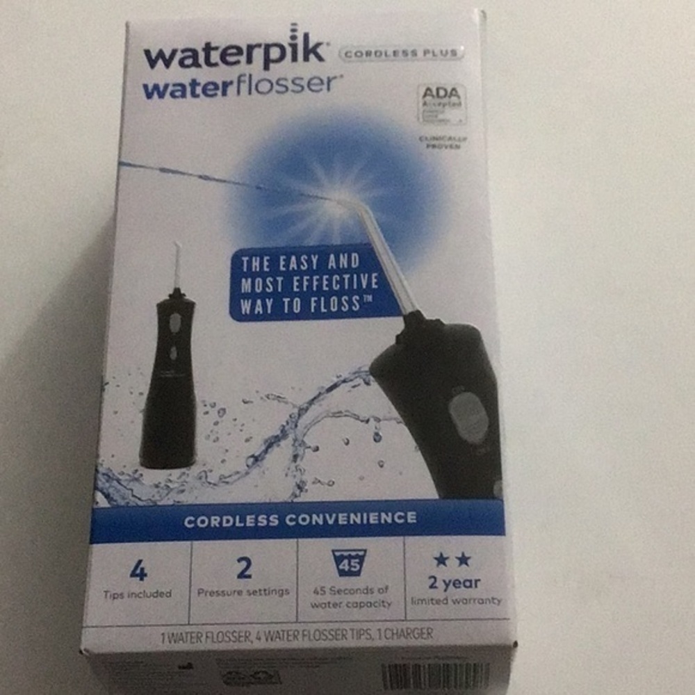 NIB Waterpik Water Flosser Jet Black Sealed Flosser, 4 Tips & Charger
